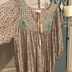 Babydoll top embroidery accent